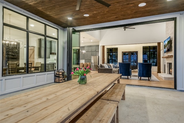 view of patio with a deck and a ceiling fan