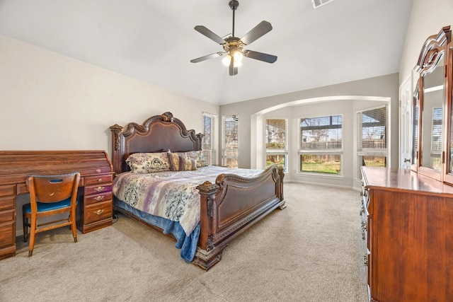 bedroom with vaulted ceiling, visible vents, a ceiling fan, and carpet floors