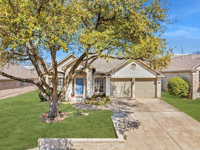 view of front of home featuring driveway, an attached garage, and a front lawn