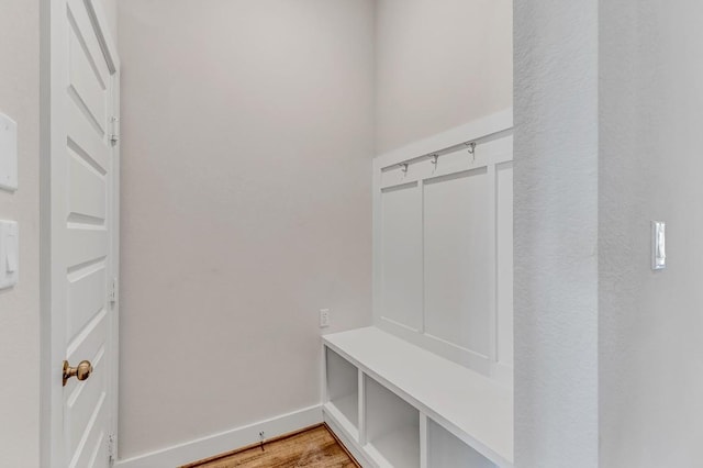 mudroom featuring baseboards and light wood-style flooring