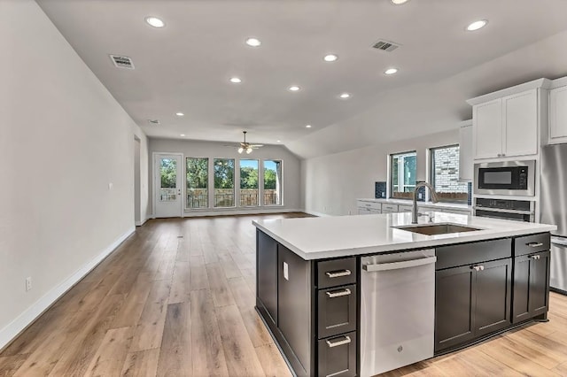 kitchen featuring plenty of natural light, visible vents, appliances with stainless steel finishes, and a sink