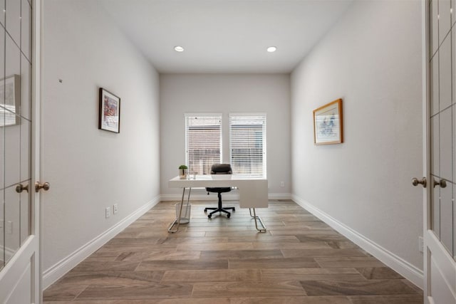 office space featuring recessed lighting, wood finished floors, and baseboards