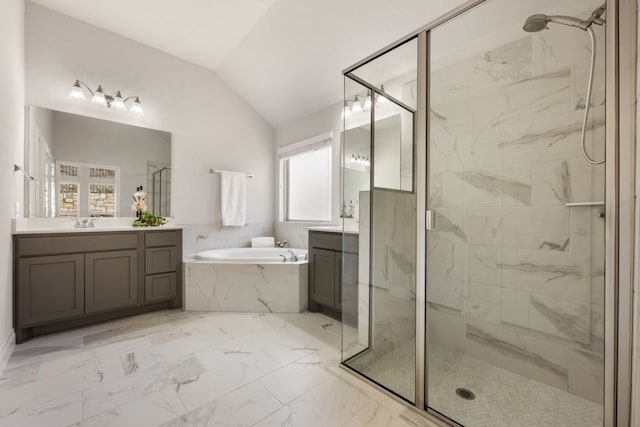 bathroom featuring vanity, a marble finish shower, vaulted ceiling, a bath, and marble finish floor