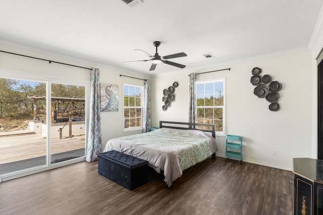 bedroom featuring multiple windows, wood finished floors, access to exterior, and ornamental molding