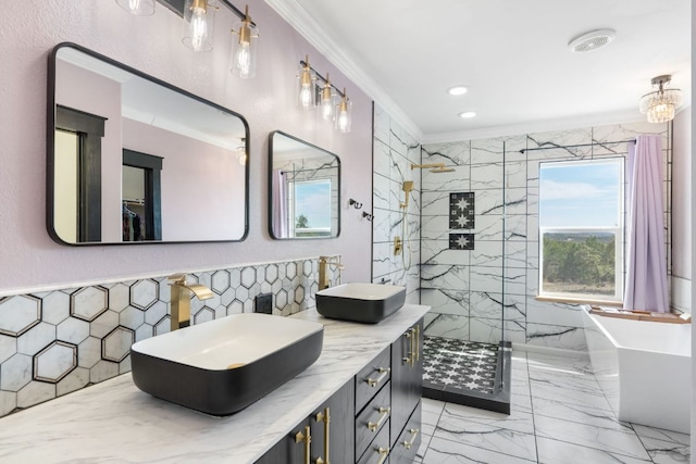 full bathroom with a sink, marble finish floor, a shower stall, and crown molding