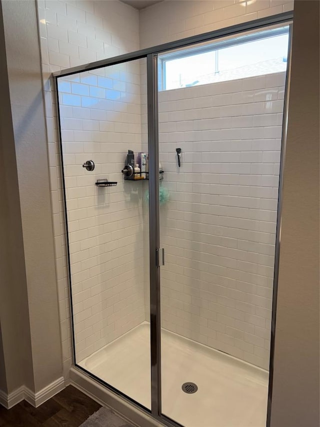 full bathroom featuring a stall shower