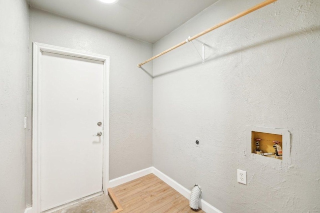 washroom featuring wood finished floors, baseboards, hookup for an electric dryer, hookup for a washing machine, and laundry area