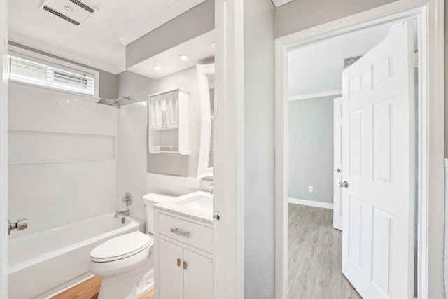 full bathroom featuring vanity, wood finished floors, visible vents, bathing tub / shower combination, and toilet