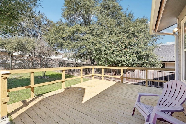 deck featuring a yard and a fenced backyard