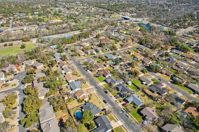 bird's eye view with a residential view and a water view