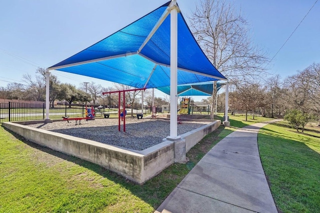 view of community with playground community and a lawn