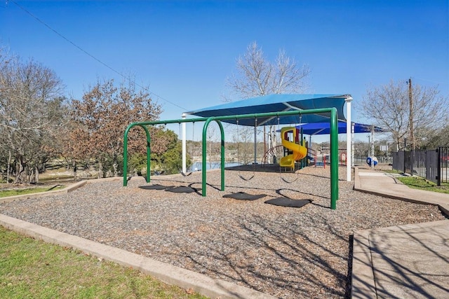 communal playground featuring fence