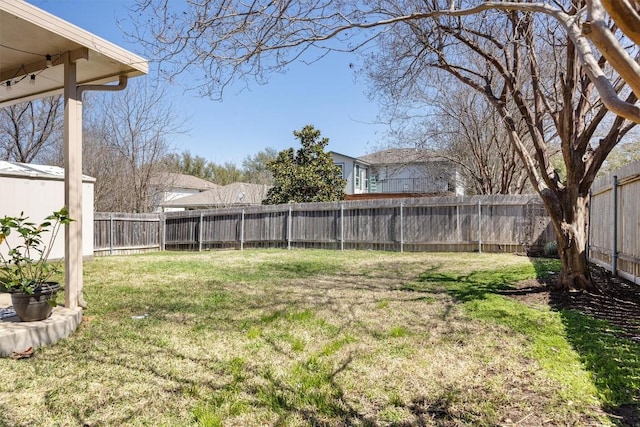 view of yard with a fenced backyard