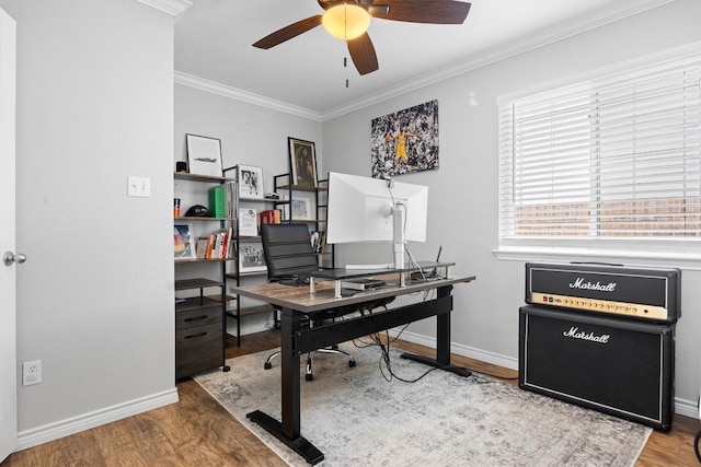 office area with baseboards, crown molding, a ceiling fan, and wood finished floors