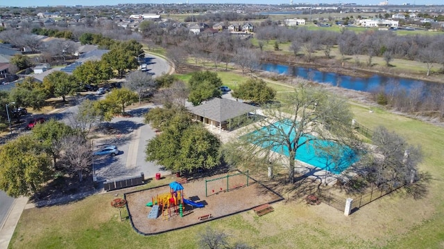 birds eye view of property featuring a water view