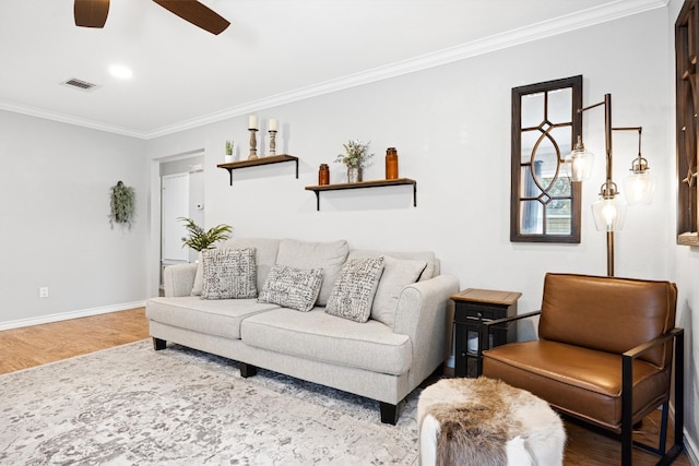 living area featuring visible vents, crown molding, a ceiling fan, and wood finished floors