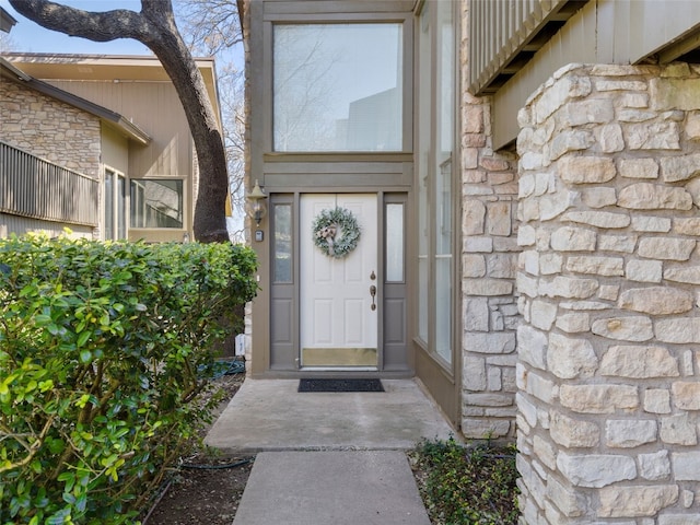 entrance to property with stone siding