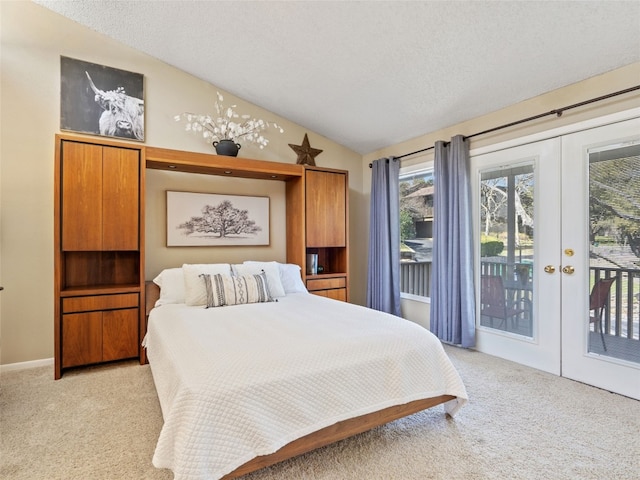 bedroom featuring french doors, light colored carpet, vaulted ceiling, and access to outside