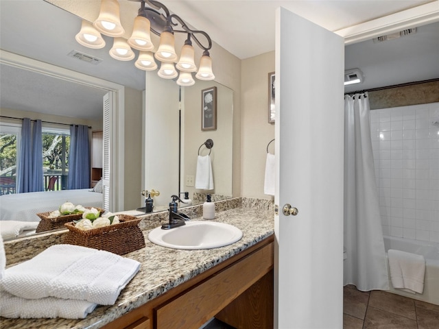 bathroom with tile patterned flooring, visible vents, vanity, and shower / bath combo