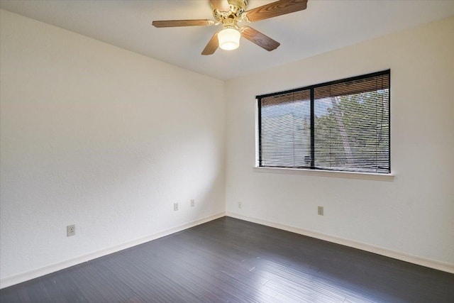 405 S Cowal Dr, Spicewood, TX 78669 - unfurnished room with dark wood finished floors, baseboards, and ceiling fan