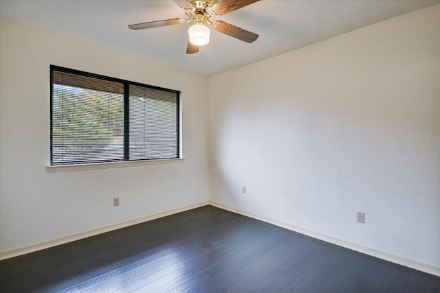 405 S Cowal Dr, Spicewood, TX 78669 - empty room with dark wood-type flooring, baseboards, and ceiling fan