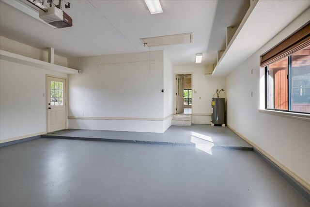 405 S Cowal Dr, Spicewood, TX 78669 - garage with a garage door opener and electric water heater