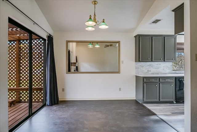 405 S Cowal Dr, Spicewood, TX 78669 - unfurnished dining area with a chandelier and baseboards
