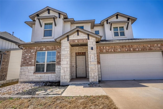 183 Concho Creek Loop, Leander, TX 78641 - view of front facade with concrete driveway, stucco siding, stone siding, and brick siding