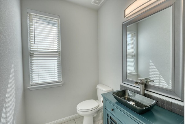183 Concho Creek Loop, Leander, TX 78641 - half bath featuring healthy amount of natural light, vanity, and tile patterned floors