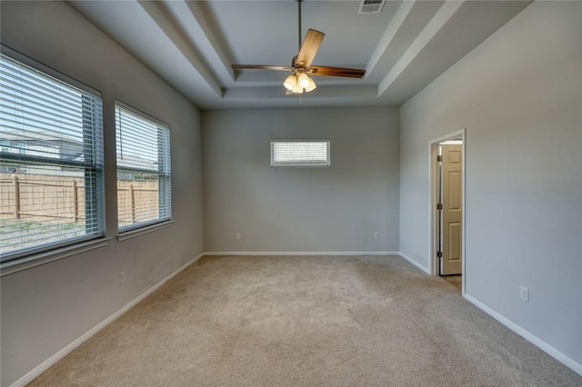 183 Concho Creek Loop, Leander, TX 78641 - spare room featuring a raised ceiling, carpet floors, and a ceiling fan