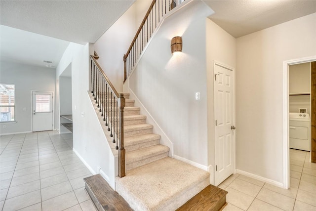 183 Concho Creek Loop, Leander, TX 78641 - stairs with washer / clothes dryer and tile patterned floors
