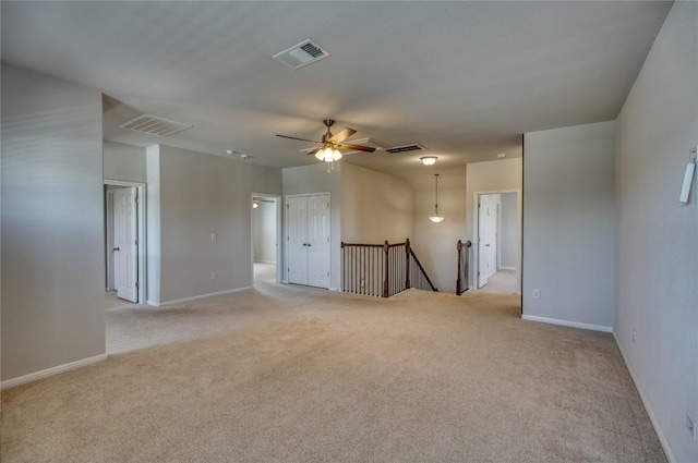 183 Concho Creek Loop, Leander, TX 78641 - unfurnished room with light carpet and ceiling fan