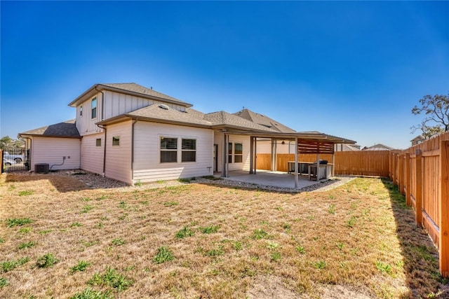 183 Concho Creek Loop, Leander, TX 78641 - back of house with a patio area, a fenced backyard, and board and batten siding