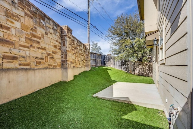 view of yard with a patio and a fenced backyard