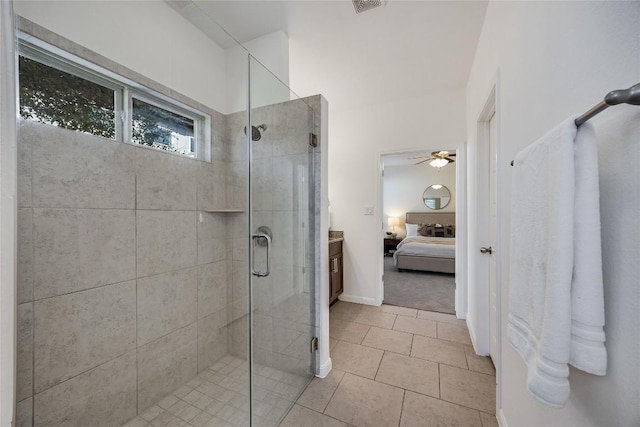 ensuite bathroom with tile patterned floors, visible vents, a ceiling fan, ensuite bath, and a shower stall