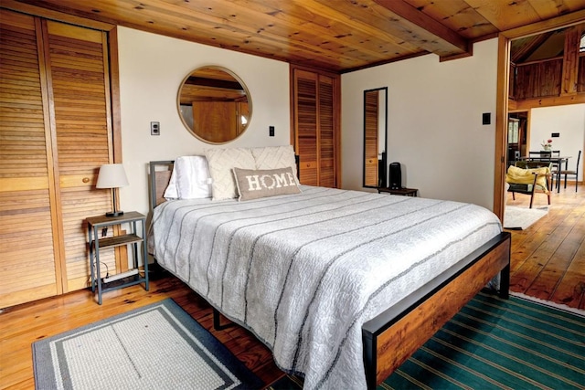 bedroom with wood ceiling and hardwood / wood-style floors