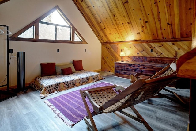 bedroom with wooden walls, wood finished floors, and vaulted ceiling