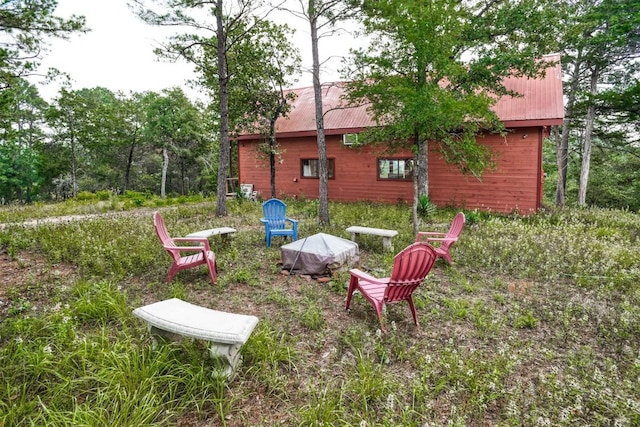 view of yard featuring an outdoor fire pit