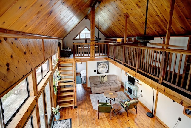 living room featuring lofted ceiling, wooden ceiling, and wood-type flooring