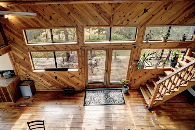 interior space featuring wood walls and wood-type flooring