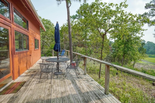 215 Lakeview Dr, Smithville, TX 78957 - wooden deck featuring outdoor dining area