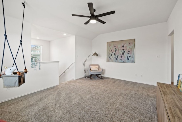 unfurnished room with an upstairs landing, recessed lighting, carpet flooring, ceiling fan, and vaulted ceiling