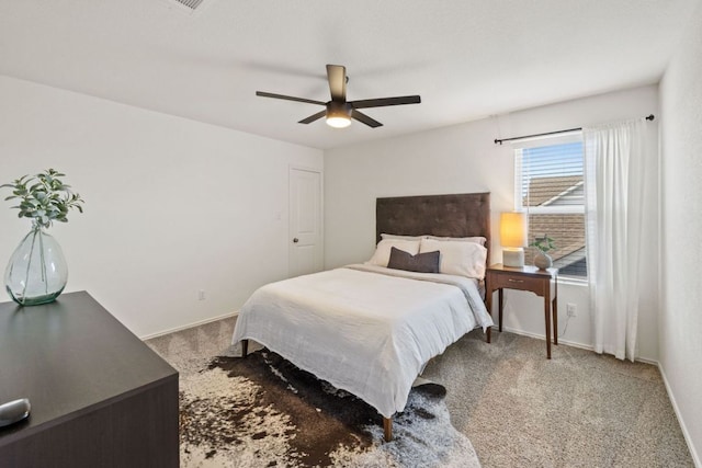 bedroom with baseboards, carpet floors, and ceiling fan