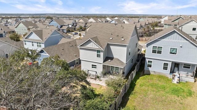 birds eye view of property with a residential view