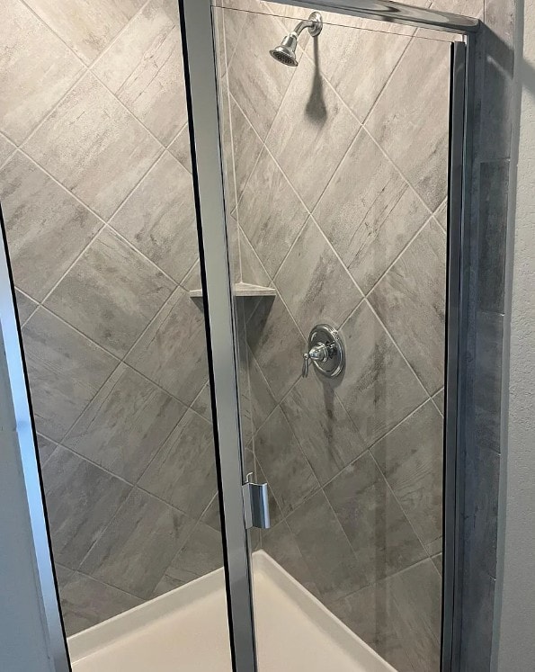 bathroom with a shower stall