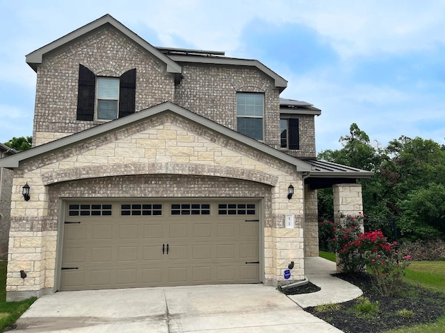 view of front of property with stone siding and driveway