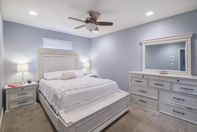 bedroom featuring recessed lighting, a ceiling fan, and dark carpet