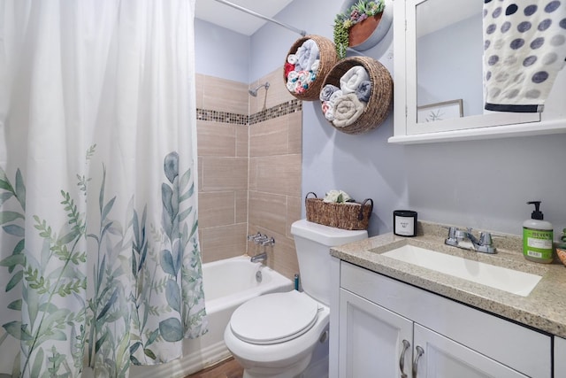 bathroom featuring toilet, vanity, and shower / bath combo