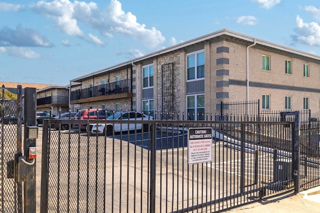 view of building exterior with fence