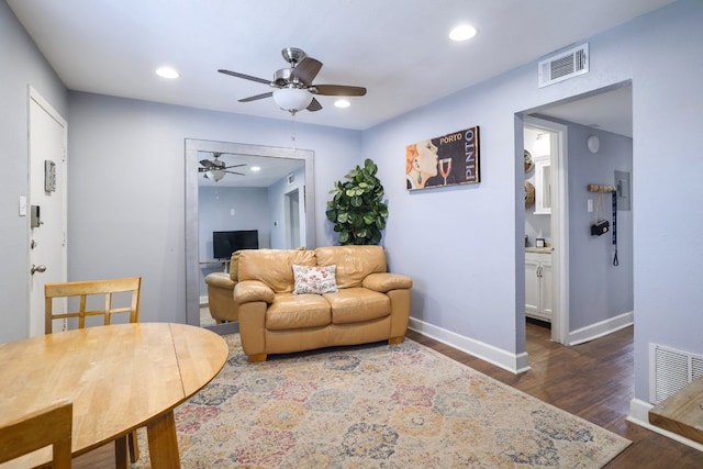 living room with dark wood-type flooring, recessed lighting, a ceiling fan, and visible vents